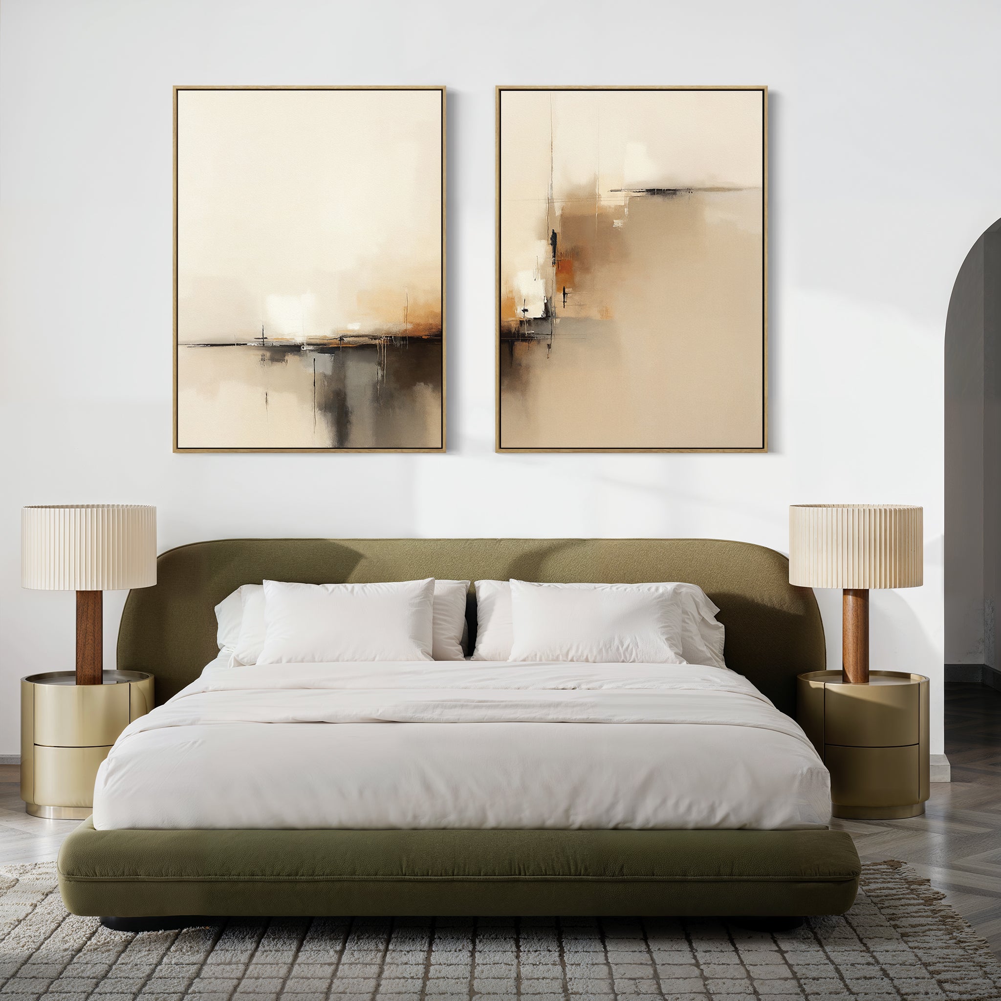A modern bedroom with an olive green bed, white bedding, round gold nightstands and pleated lamps, a gray patterned rug, and the Burnt Sienna Convergence - Set Of 2 abstract prints above the bed for a touch of modern elegance.
