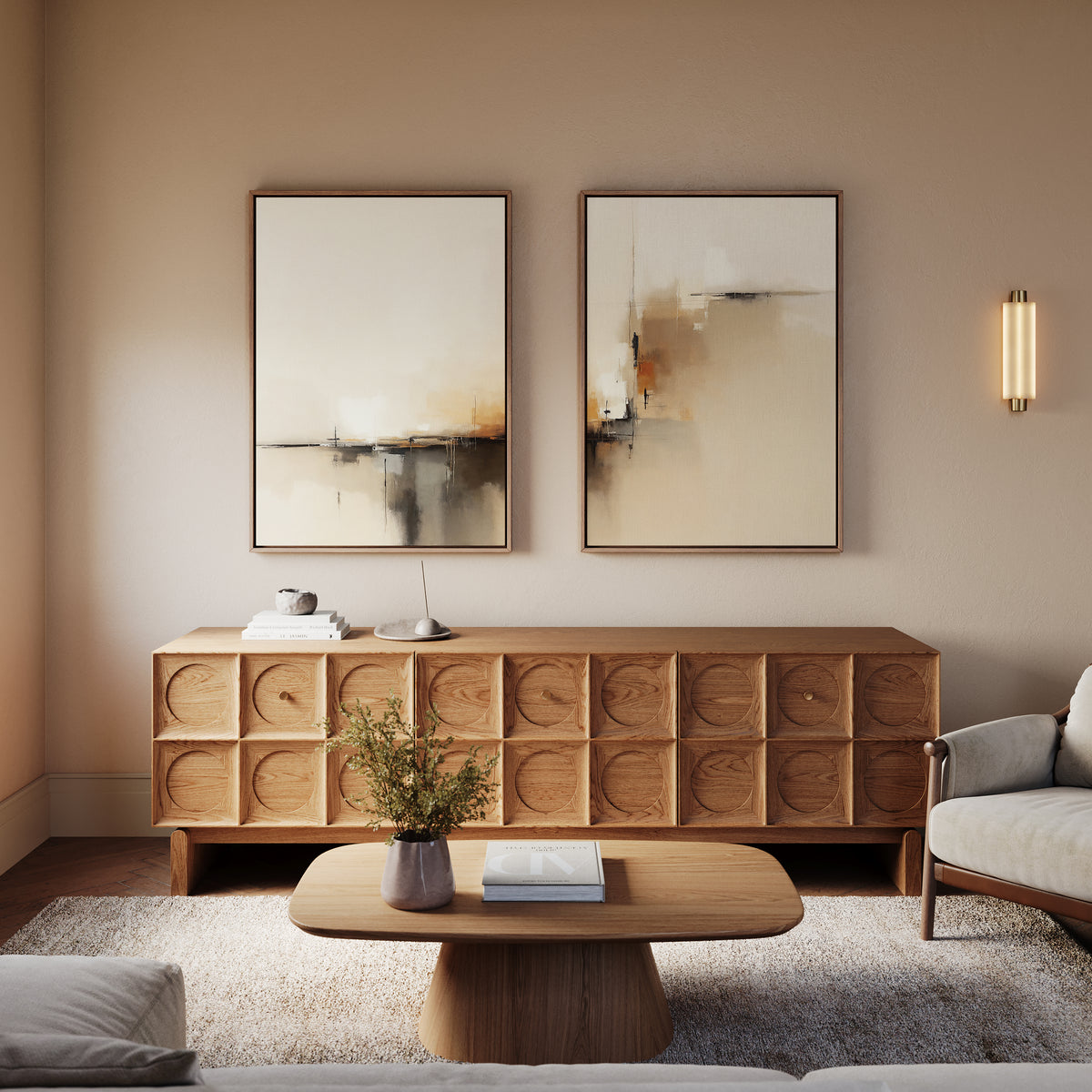 A modern living room with a wooden coffee table, patterned wood sideboard, Burnt Sienna Convergence - Set Of 2 wall art, a small plant on the table, and a beige armchair. Warm neutrals and soft lighting add to the modern elegance.