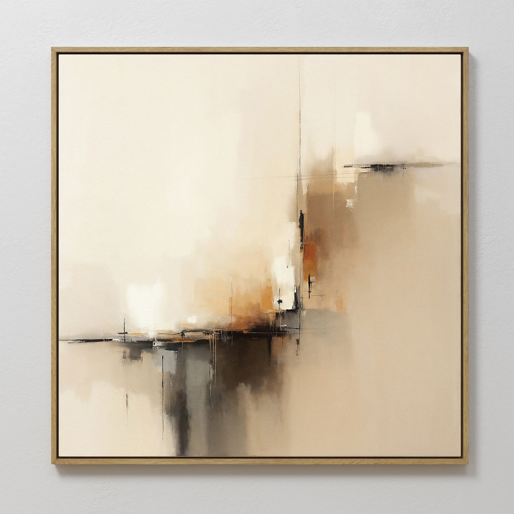The Burnt Sienna Convergence Canvas Art - Square features a contemporary mix of beige, cream, brown, and black brushstrokes. Framed in thin gold, this elegant wall art adds a soft, modern touch to any light-colored room.