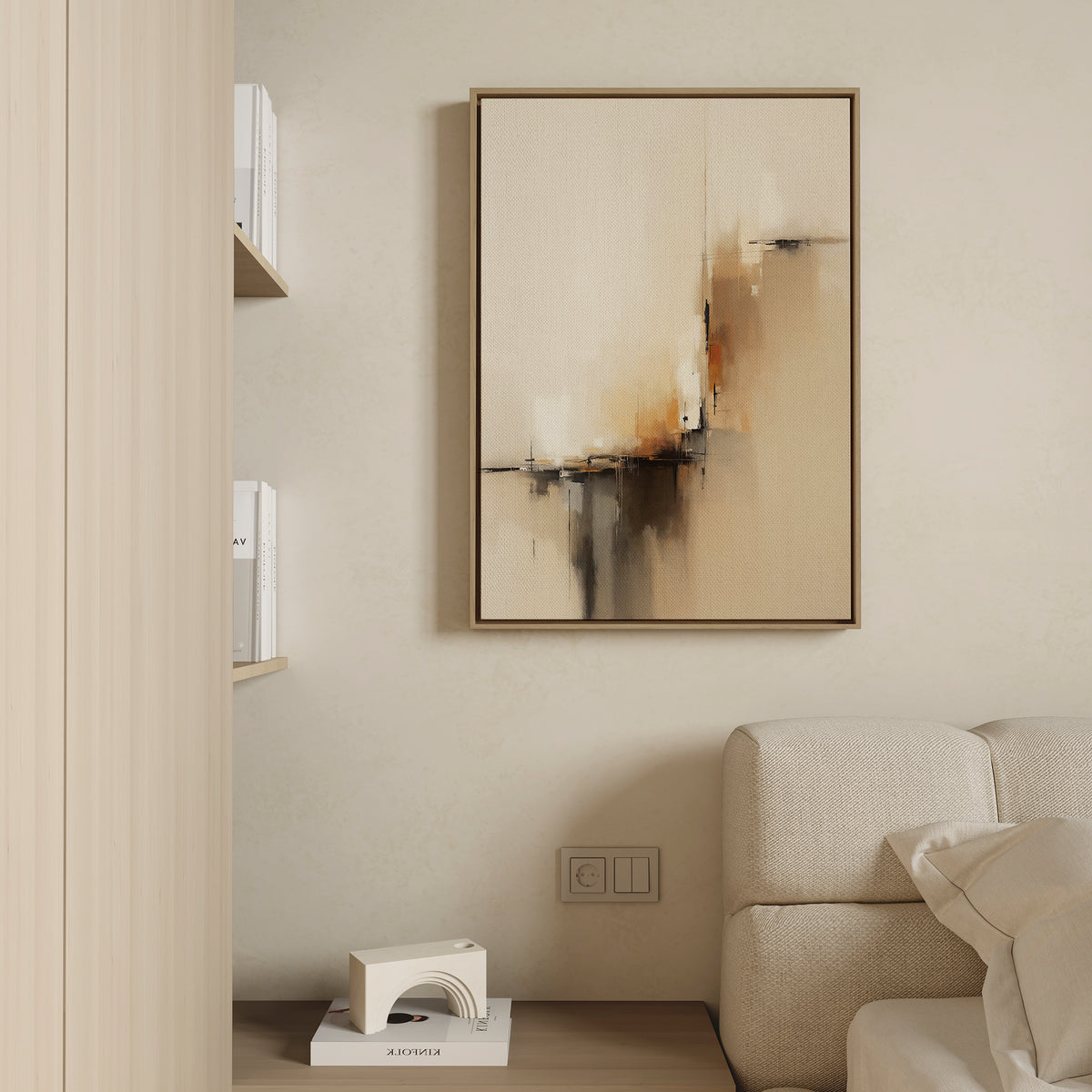 A modern living room corner with a beige couch, built-in wooden shelves with books, and the Burnt Sienna Convergence Canvas Art - Vertical featuring neutral tones and geometric brushstrokes on a light-colored wall.