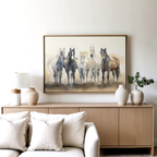 A modern living room with a light wood sideboard, white vases, a lamp, and the striking Sunset Ride Canvas Art above it. In front sits a white sofa with beige pillows, completing this elegant decor.