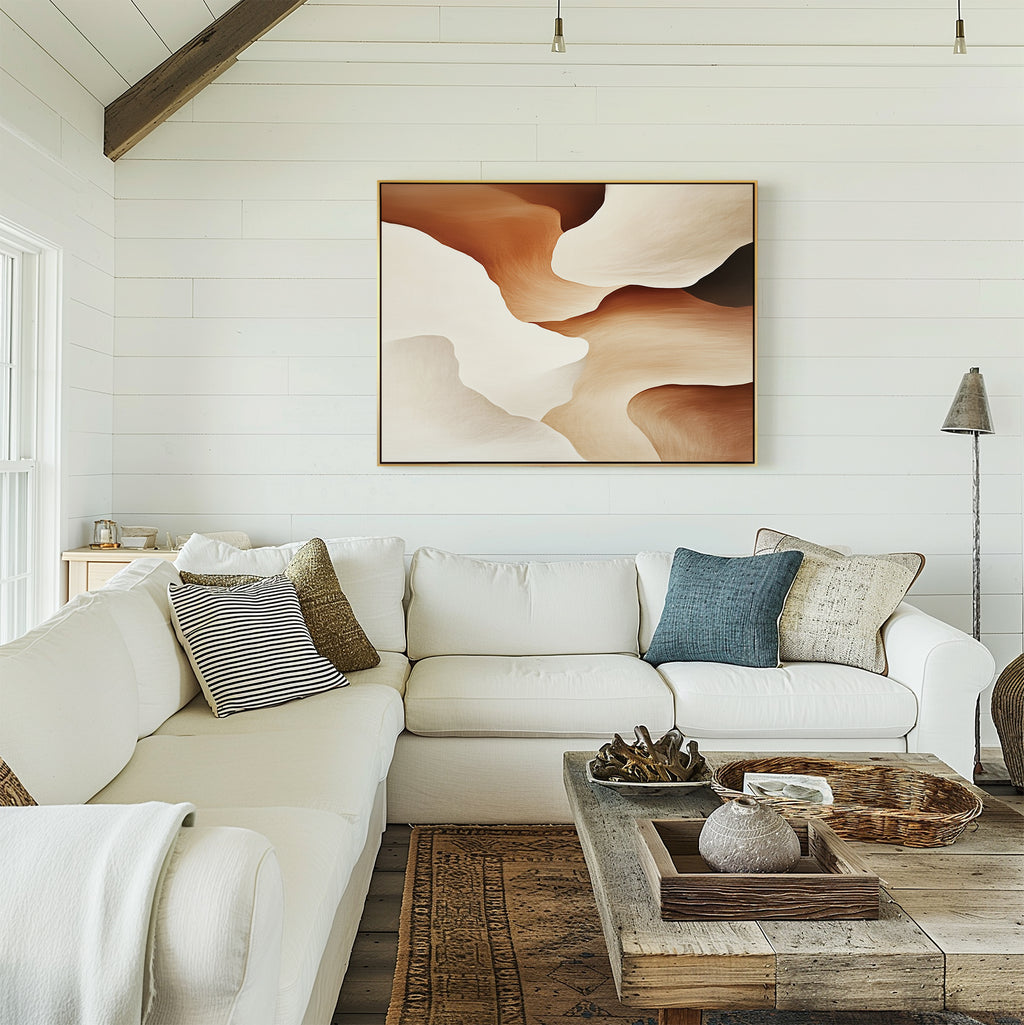 A bright, cozy living room with a white sectional sofa, assorted pillows, a rustic wooden coffee table, and the Canyon Curves Canvas Art - Horizontal in warm earth tones on a shiplap-paneled wall.