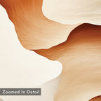 The Canyon Curves Canvas Art - Square features smooth, wavy shapes in beige, cream, and brown with a soft texture. This contemporary print is ideal for wall decor. A corner label reads “Zoomed In Detail.”.
