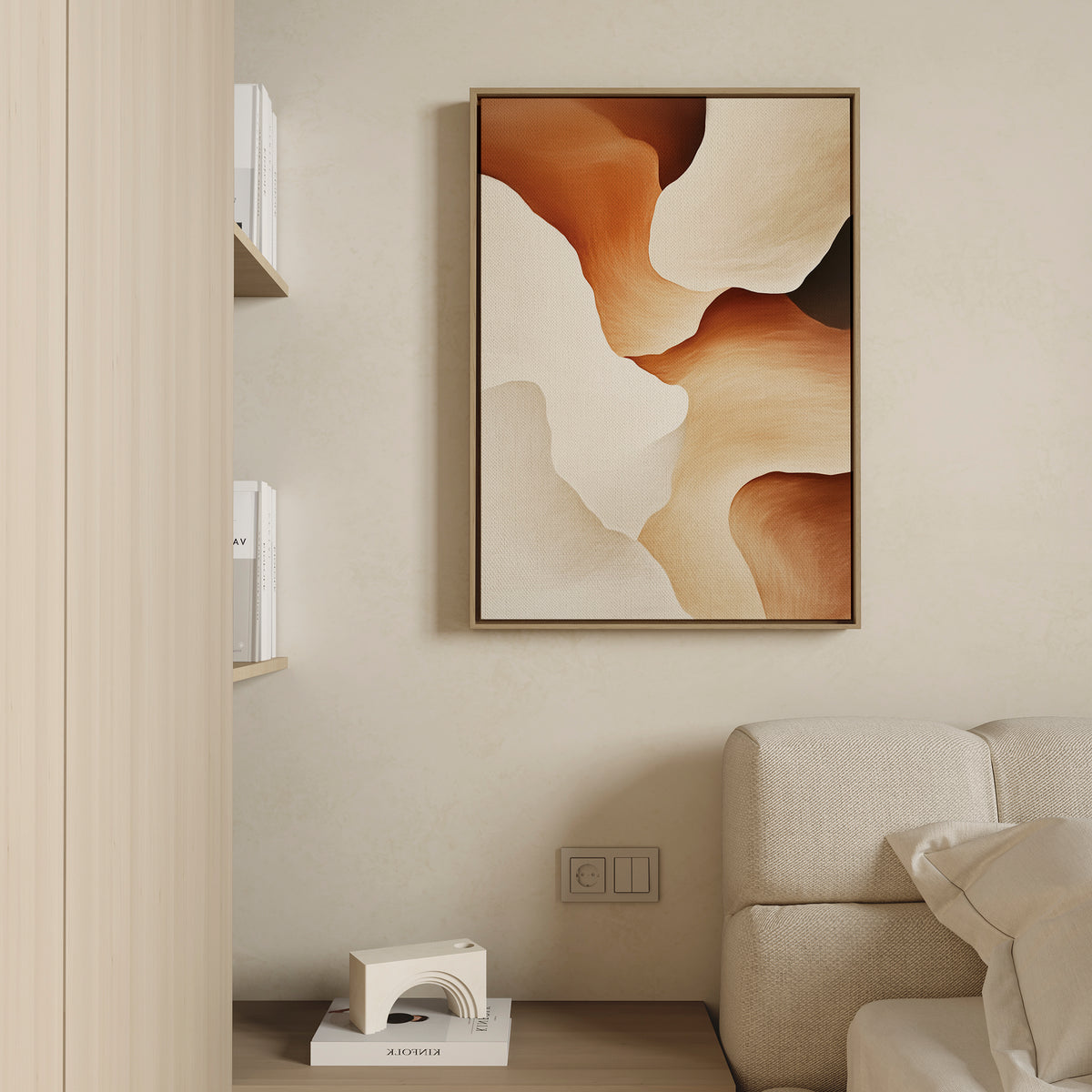 A neutral living room features a light beige sofa, minimalist shelving, and the Canyon Curves Canvas Art - Vertical with earthy brown and cream swirls. A small decorative object on the bottom shelf completes this serene modern space.