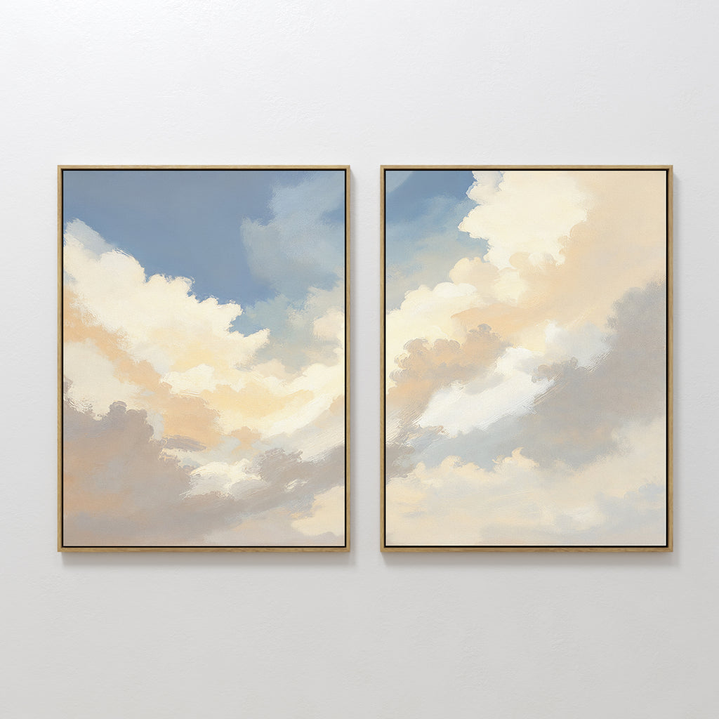 Celestial Embrace - Set of 2 framed canvas prints features soft clouds in a blue and golden sky, bringing a serene, airy vibe to any room—perfect for adding Nordic Park-inspired calm and elegance to your space.