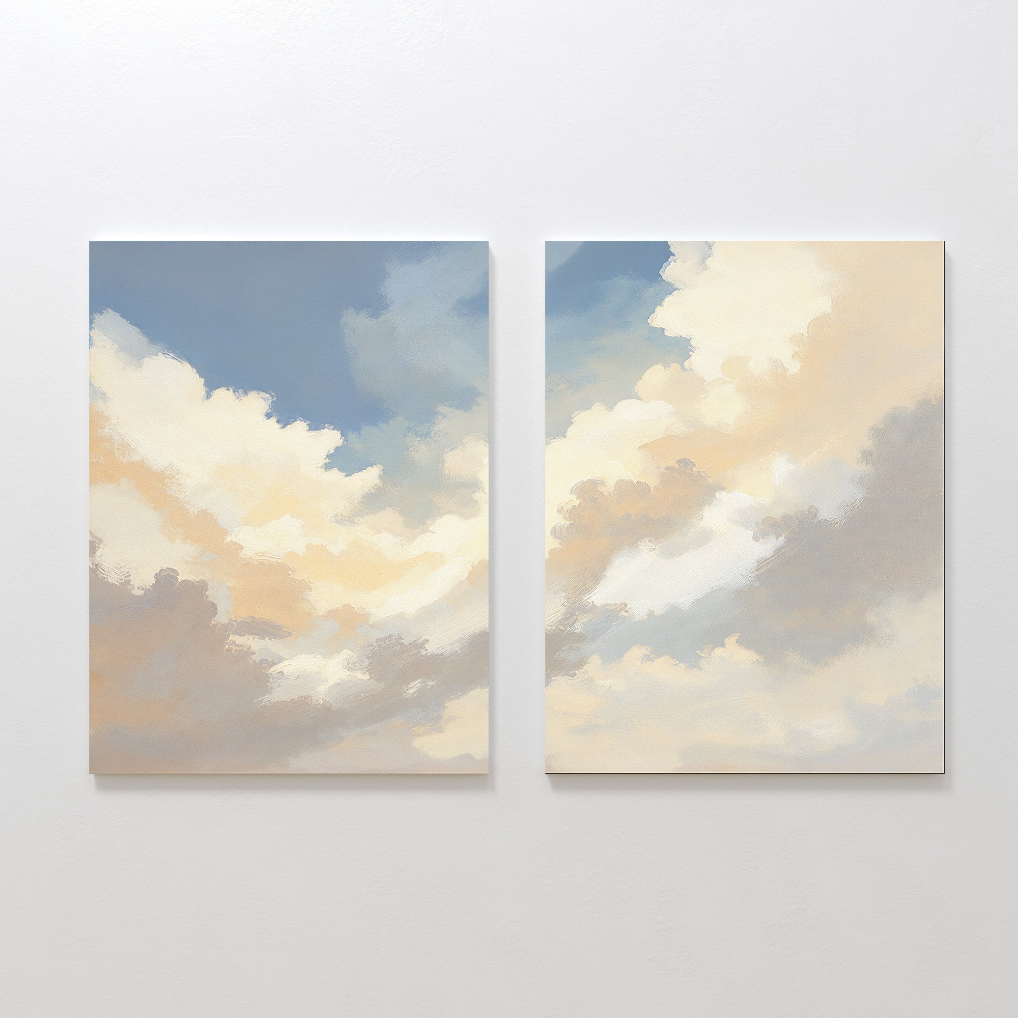 Celestial Embrace - Set of 2 features canvas prints with soft blue, white, and beige clouds. Displayed side by side, this wall art brings a tranquil Nordic Park vibe to your space.
