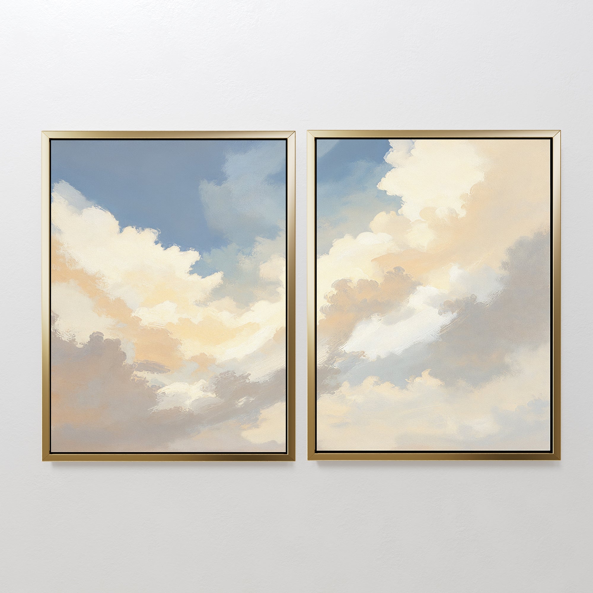 Celestial Embrace - Set of 2 features framed canvas prints displaying soft clouds in blue and gold hues. This Nordic Park-inspired wall art brings a serene, calming touch to any white wall.