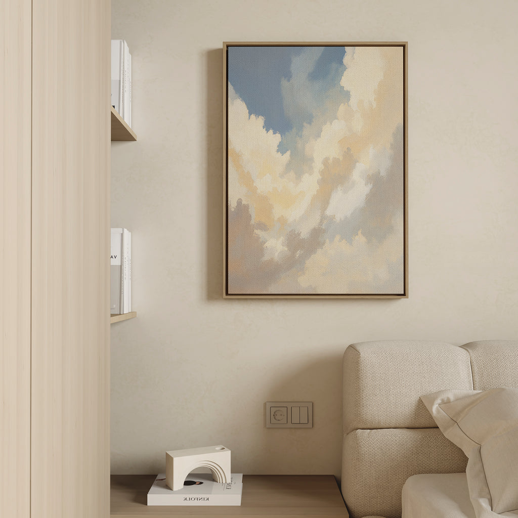 A soft, neutral living room corner features a beige sofa, books on a shelf, a modern white decorative piece, and the serene Celestial Embrace Canvas Art - Vertical—adding tranquility to this Nordic Park-inspired space.