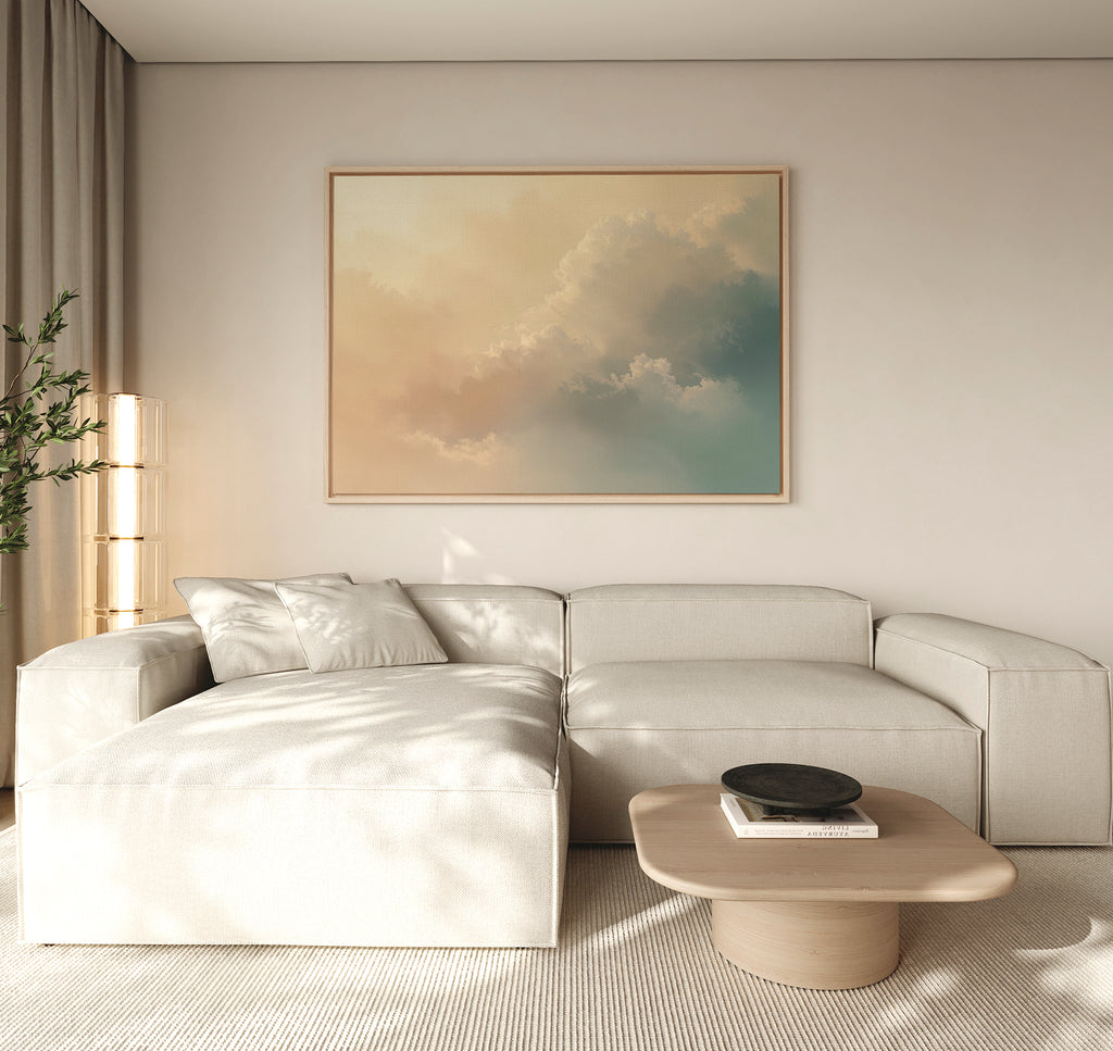 A modern living room with a light beige sectional sofa, a wooden coffee table with a black bowl, a tall plant, and the Celestial Veil Canvas Art - Horizontal displayed above the couch.