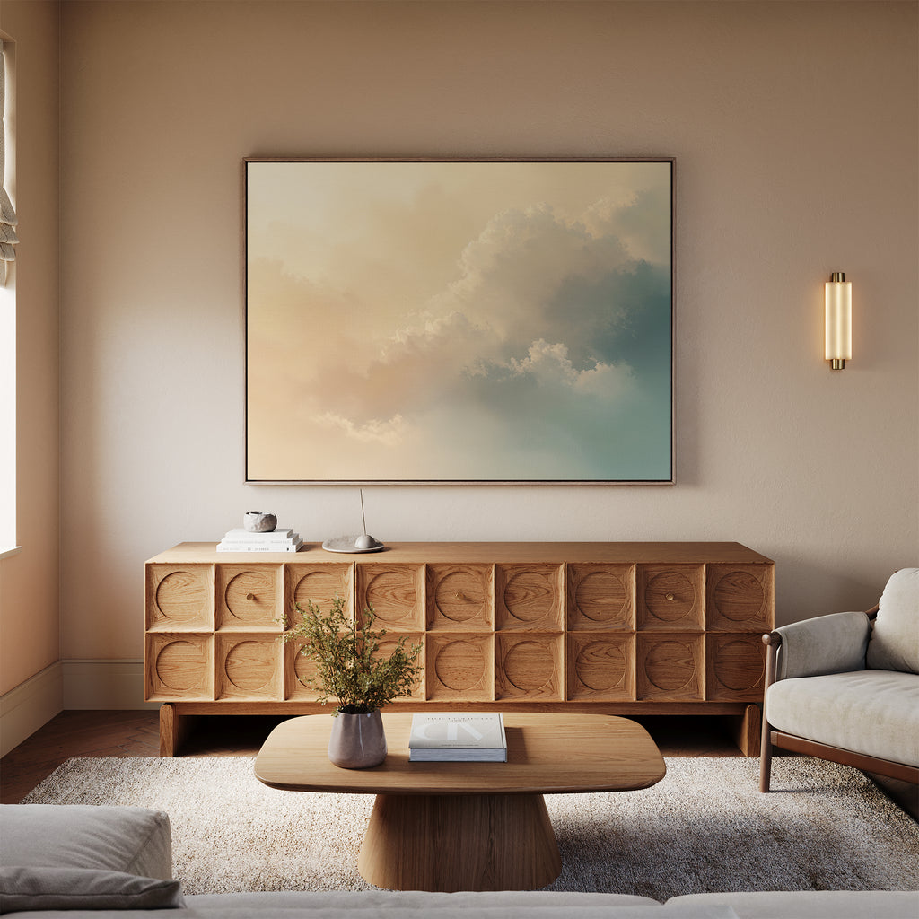 A minimal living room features a light wood coffee table, geometric wooden sideboard, and the Celestial Veil Canvas Art - Horizontal. Champagne light and neutral tones enhance the calm atmosphere with simple décor.