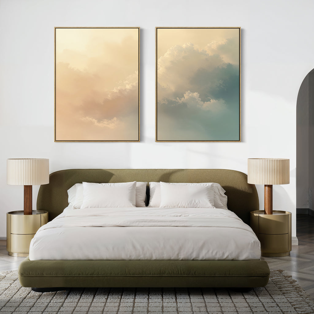 A modern bedroom with a green upholstered bed, white bedding, two gold nightstands with champagne-lit lamps, and two large Celestial Veil - Set of 2 cloud-themed canvas prints above the headboard.