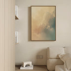 A modern living room with a beige wall, light sofa, champagne accents, wooden bookshelf with books, and the Celestial Veil Canvas Art - Vertical featuring pastel clouds hanging above the sofa.