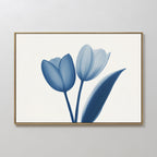 Enhance your space with the Cerulean Tulips Canvas Art - Horizontal, a framed minimalist print of two blue tulips and a leaf on white, featuring elegant lines and soft shading—a perfect touch of Nordic Park style.