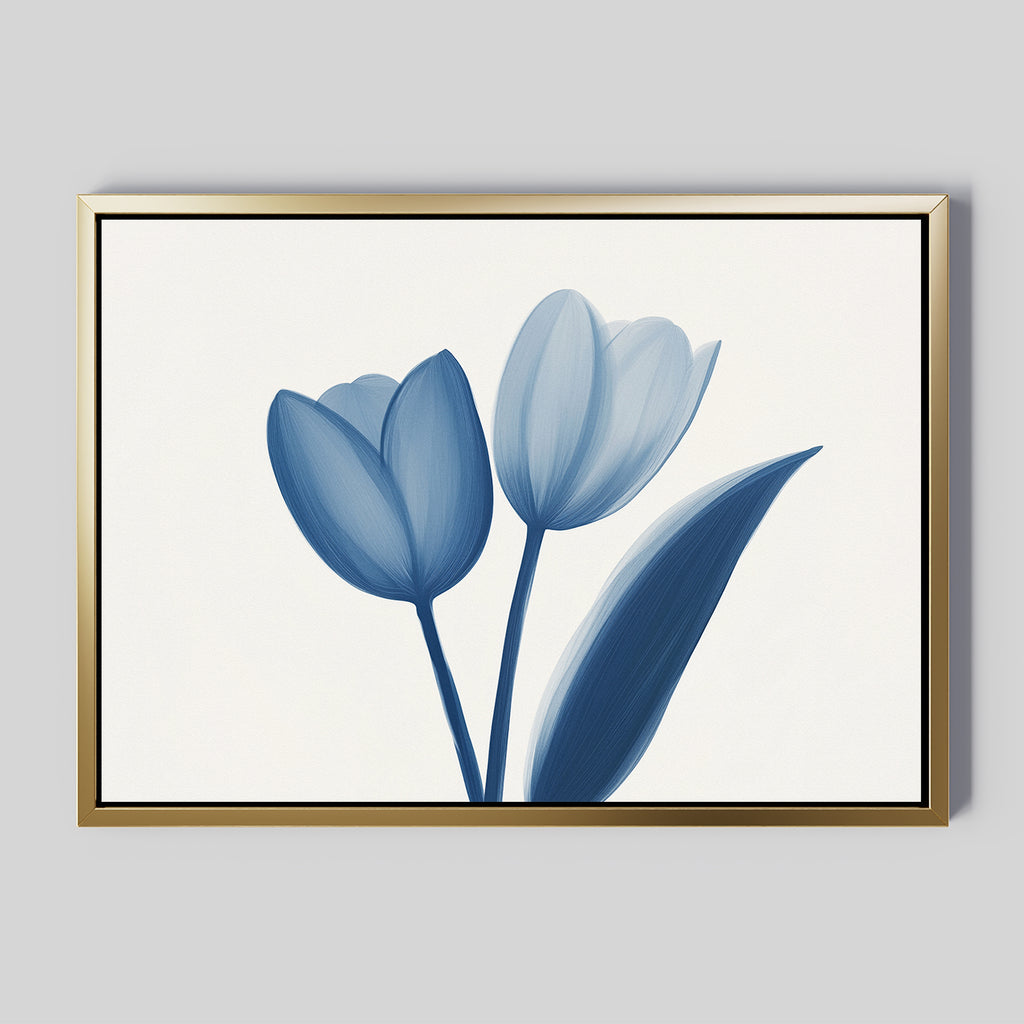 The Cerulean Tulips Canvas Art - Horizontal features two minimalist blue tulip blooms and a single leaf on a white background, framed with a thin gold border and inspired by the tranquil style of Nordic Park.