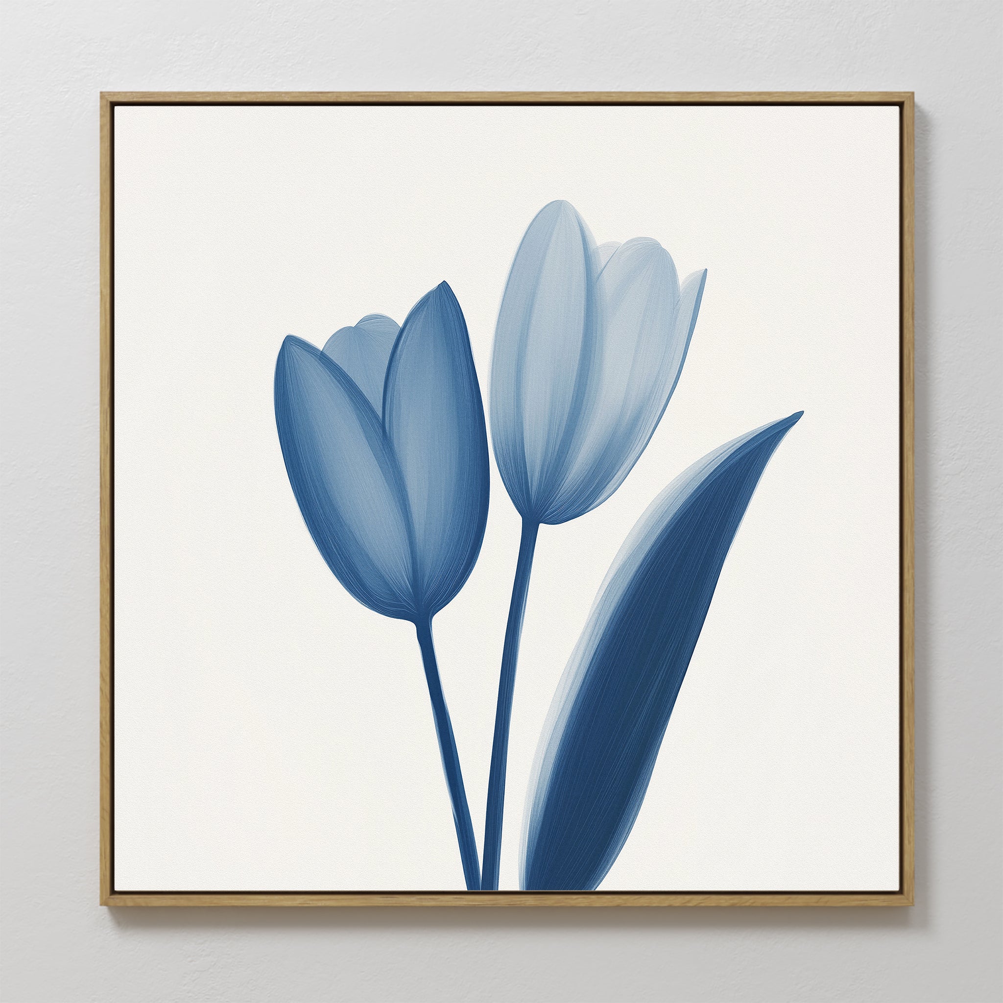 The Cerulean Tulips Canvas Art - Square features two cerulean tulips with green leaves on a white background, framed in light wood. Minimalist brushstrokes create an elegant, modern accent perfect for Nordic Park-inspired interiors.