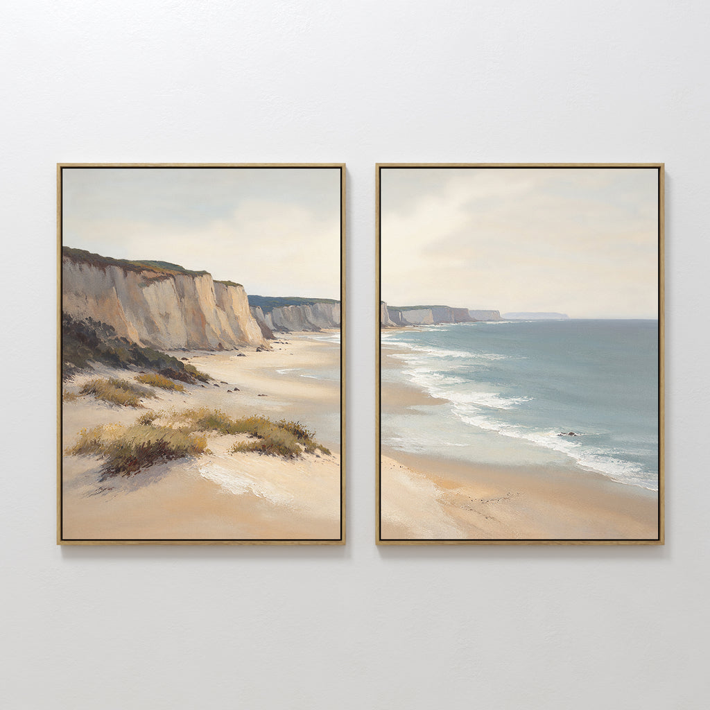 Chalk Shores - Set of 2 features elegant coastal canvas prints depicting sandy cliffs and a calm ocean under a hazy sky—ideal wall art for anyone seeking serene seaside vibes with gentle waves and minimal shoreline vegetation.