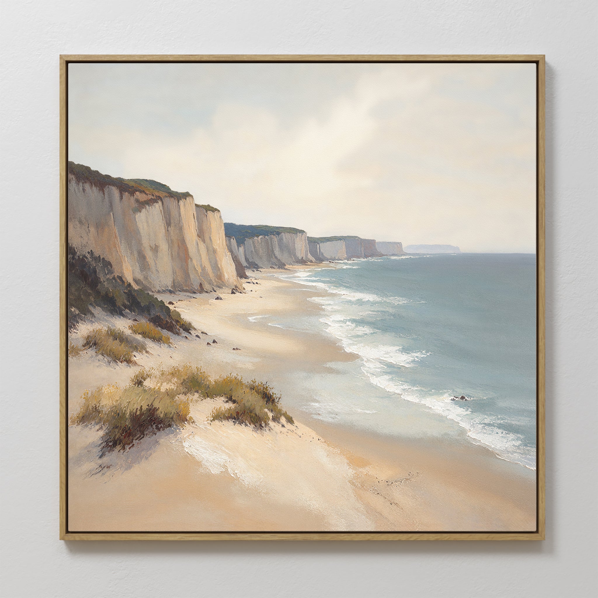 Chalk Shores Canvas Art - Square: A framed coastal canvas print featuring sandy beaches, white cliffs, and gentle waves beneath a partly cloudy sky—ideal seaside wall art to bring tranquility and charm to any space.