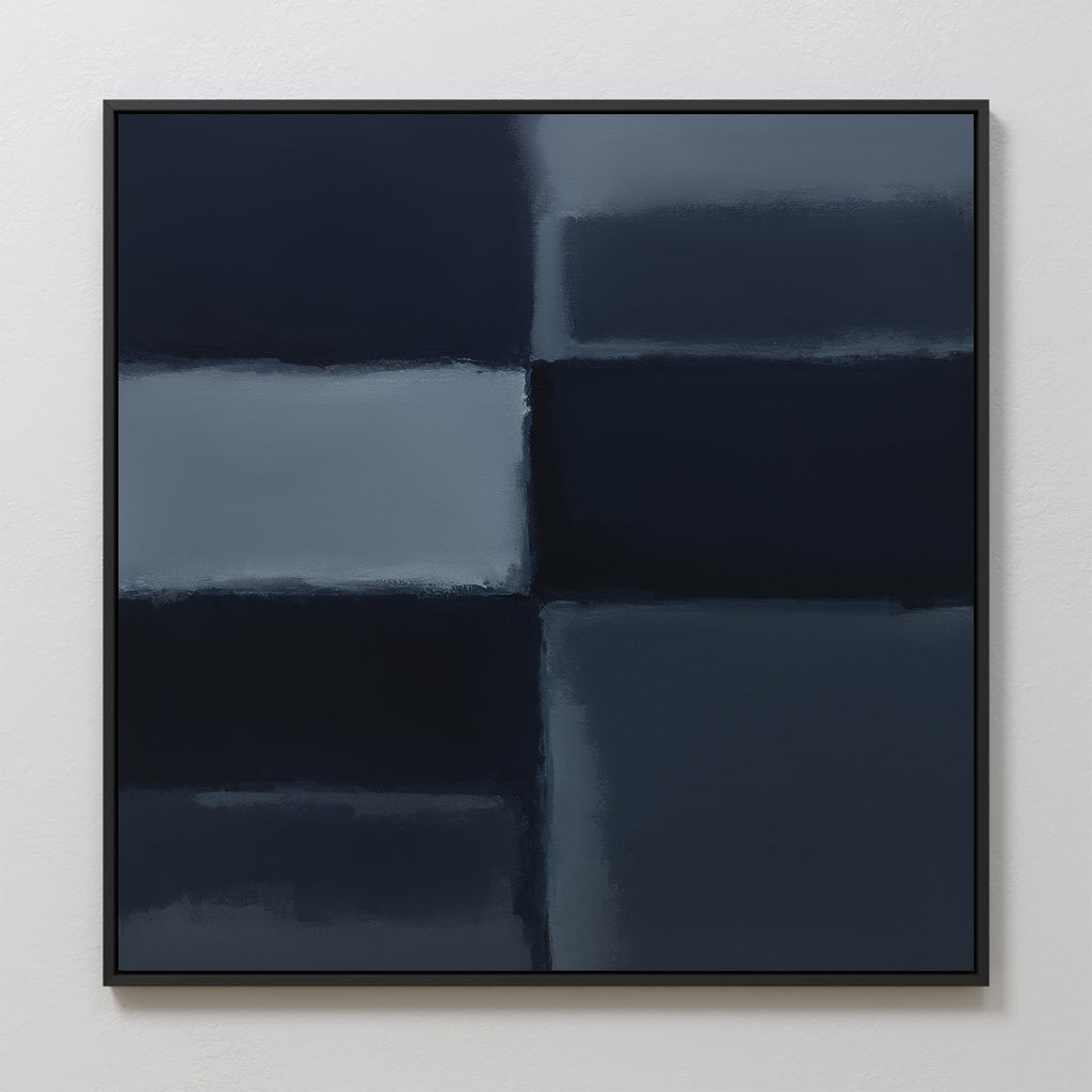 Charcoal Blocks Canvas Art - Square: A minimalist abstract painting with blurred dark blue and gray charcoal rectangles, divided by soft lines. Set in a thin black frame against a white wall—ideal for modern decor.