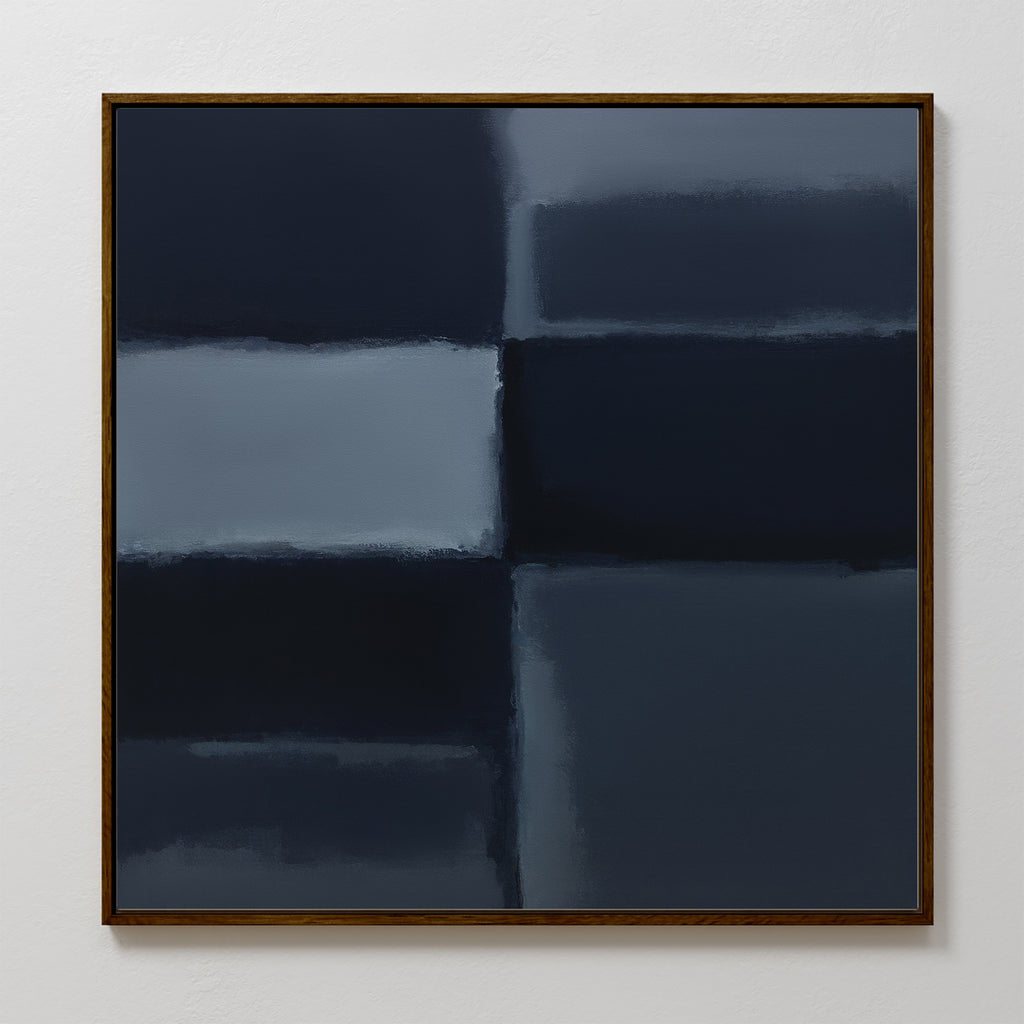 Charcoal Blocks Canvas Art - Square features four large, blurred rectangles in dark blue and navy, divided by soft lines. Framed in brown and displayed on a plain white wall, it’s ideal for modern home decor and minimalist spaces.