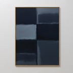 Charcoal Blocks Canvas Art - Vertical: Minimalist wall art with a grid of four large, dark blue and navy rectangles with subtle gradients, framed in light wood. Perfect for modern decor and elevating any plain white wall.
