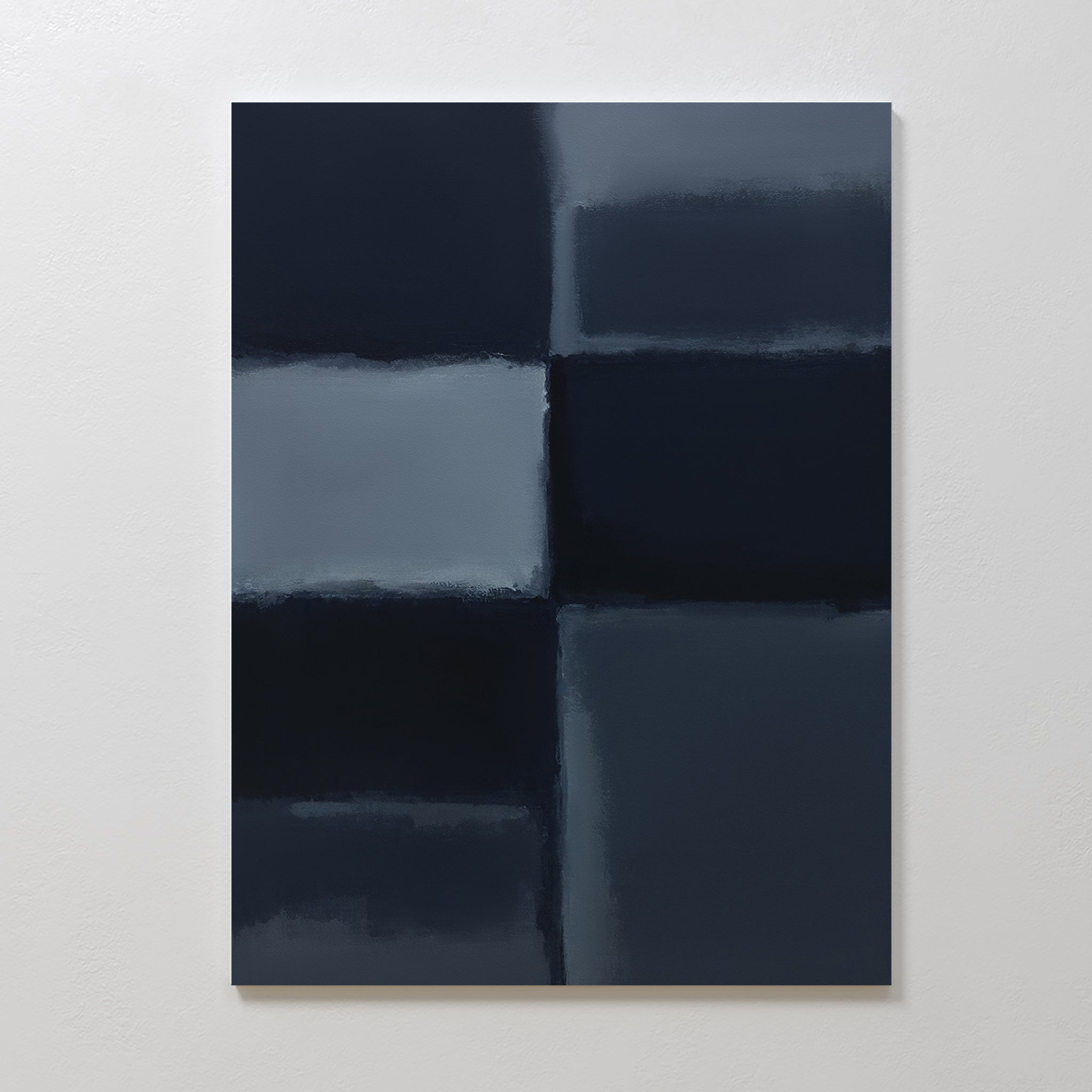 Charcoal Blocks Canvas Art - Vertical displays large, blurred rectangles in dark blue and gray tones arranged in a grid on a white wall. This geometric art print with soft edges suits modern home decor or minimalist wall art spaces.