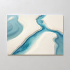 The Coastal Dreams Canvas Art - Horizontal features a winding blue river between beige sandy landmasses on a white backdrop, creating a minimalist serene look—perfect for adding tranquility to any space.