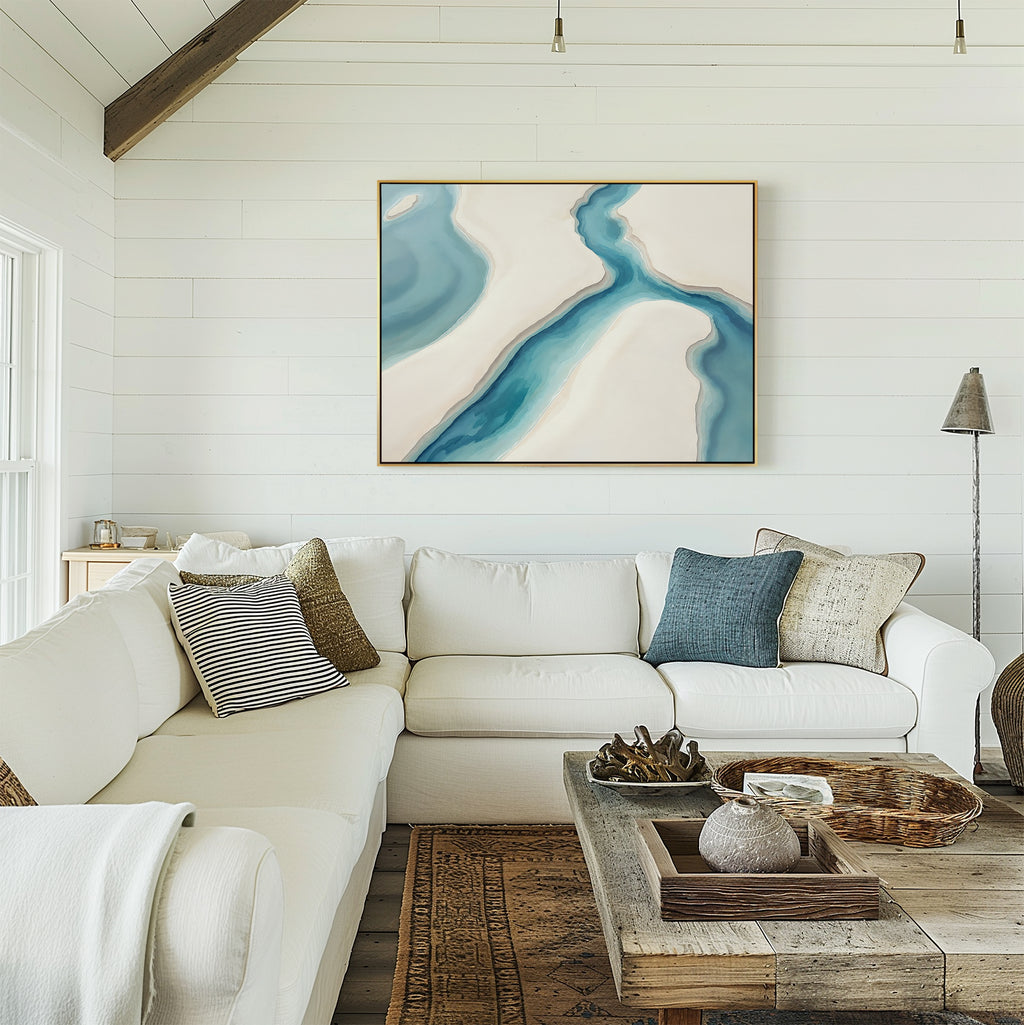 A living room with a large white couch feels calming, while the Coastal Dreams Canvas Art - Horizontal on the wall completes the tranquil look.