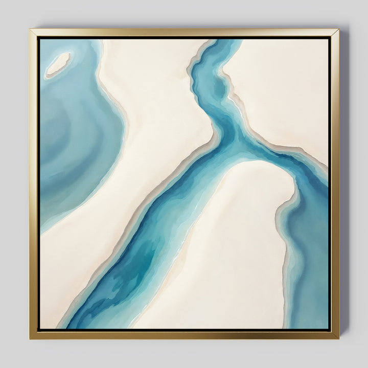 Coastal Dreams Canvas Art - Square features flowing blue and turquoise shapes like a river on cream land, set in a golden frame. This serene wall art adds minimalistic elegance and calm to any space.