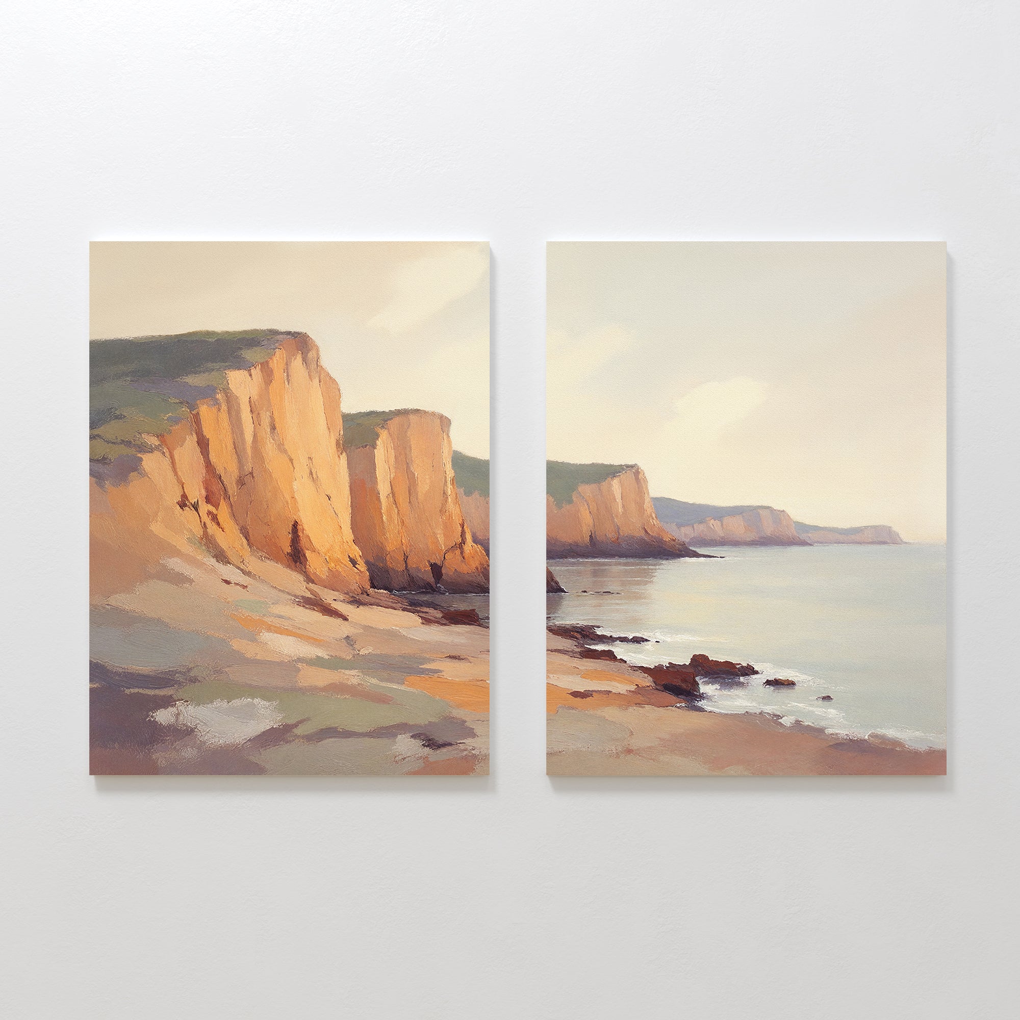 Coastal Grandeur - Set of 2 features sunlit cliffs and calm water beneath a soft, cloudy sky. The serene coastal scene flows across both canvases, with gentle shadows enhancing the rocky shore’s tranquil atmosphere.