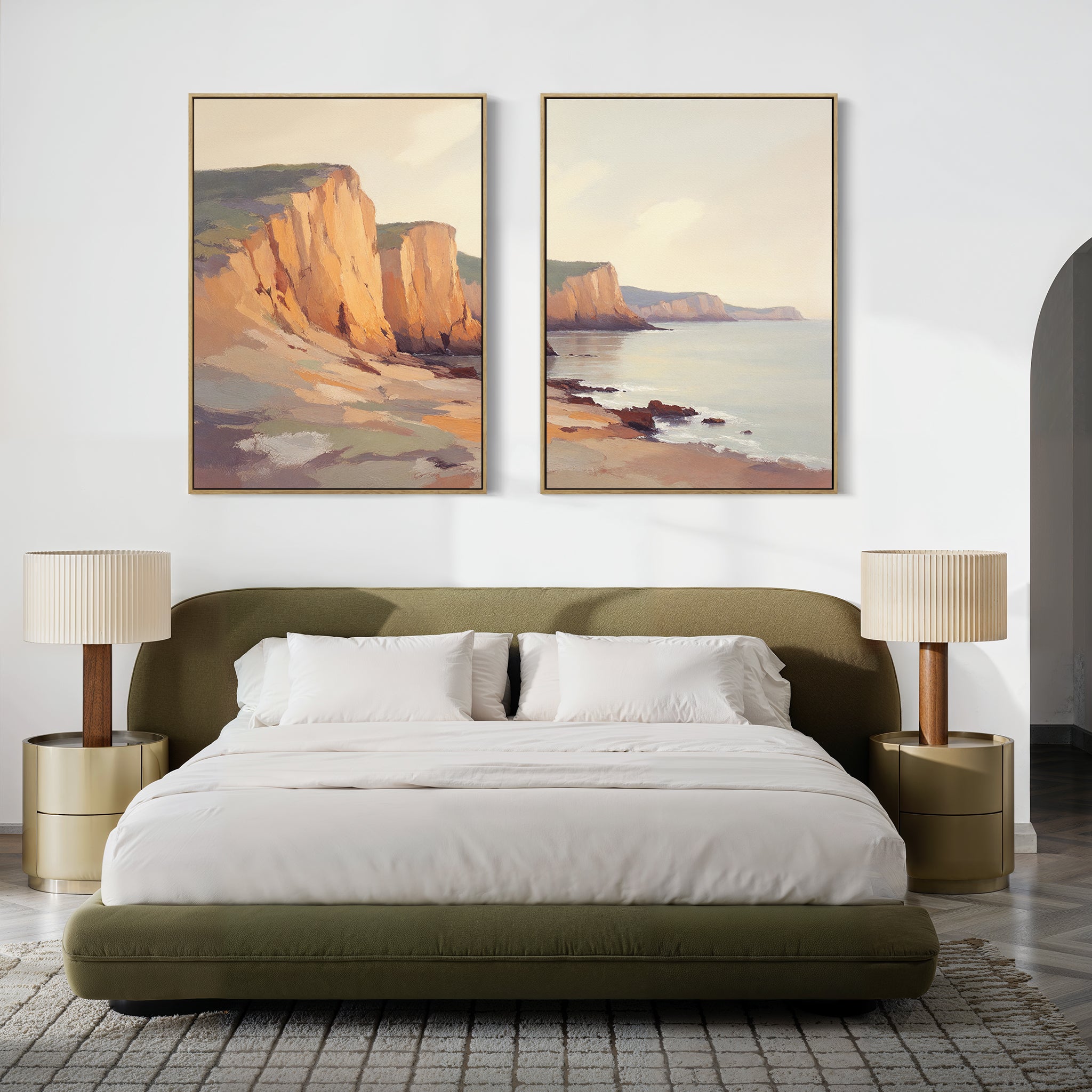 A modern bedroom with a green upholstered bed, white bedding, and gold nightstands features "Coastal Grandeur - Set of 2" canvas prints above the bed, adding a serene coastal vibe in a soft, neutral palette.