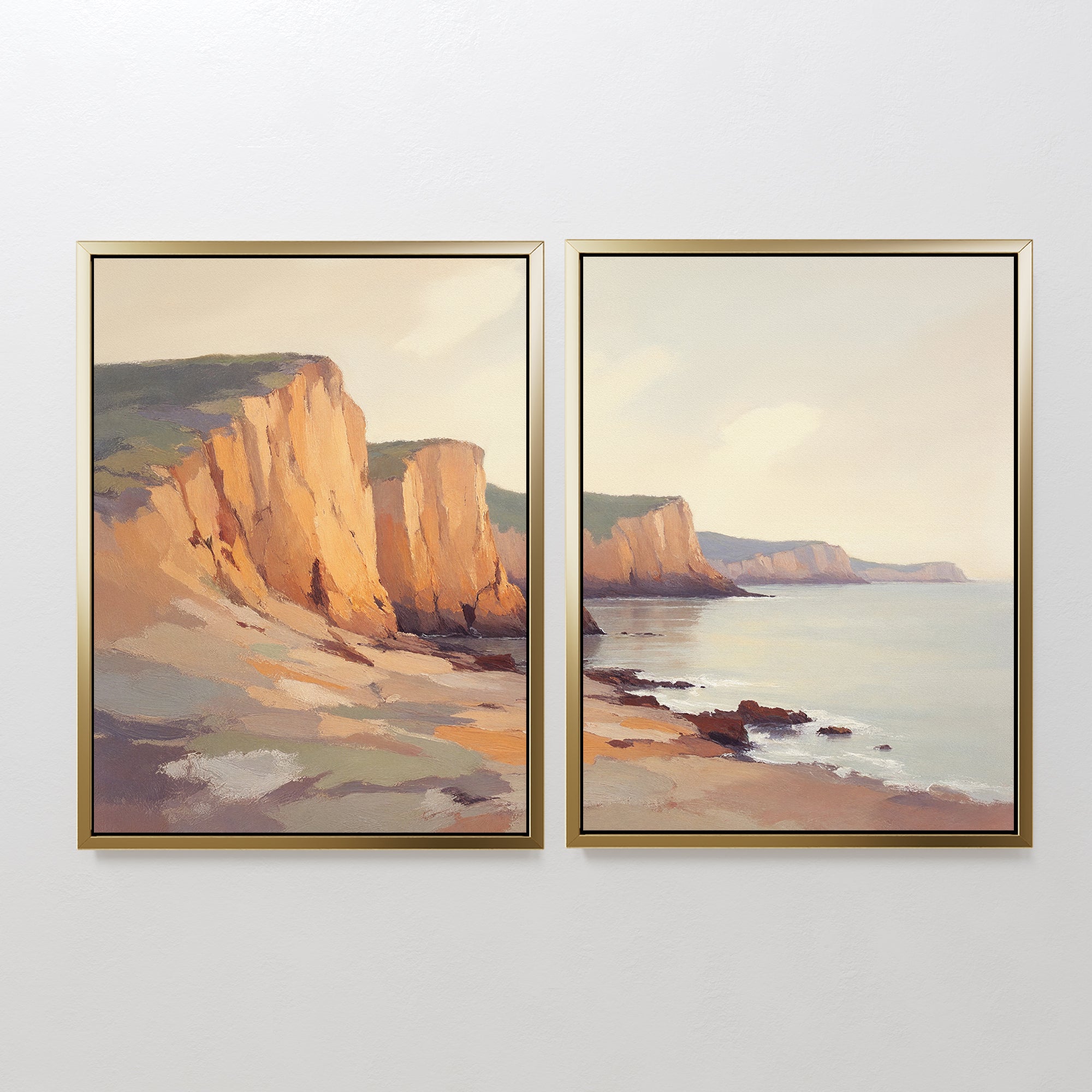 The "Coastal Grandeur - Set of 2" features framed prints that together display a serene coastal scene with orange cliffs, rocky shores, and calm water beneath a pale sky—a tranquil landscape unfolding seamlessly across both frames.