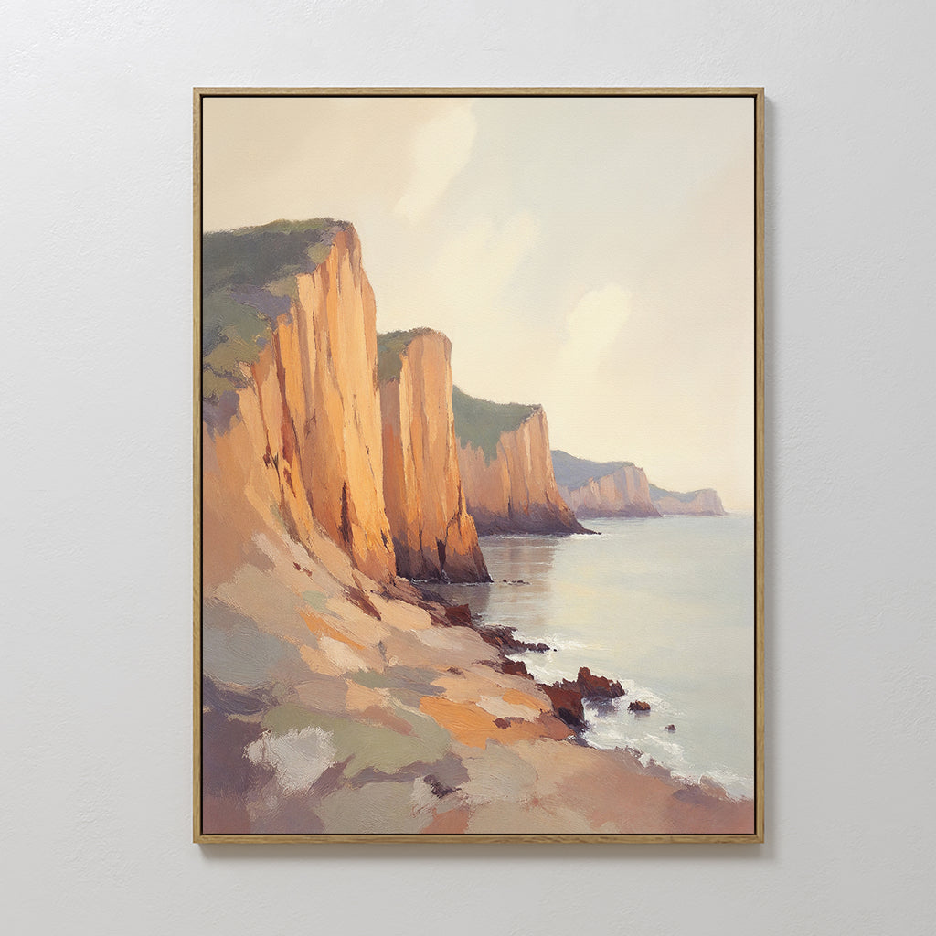 The Coastal Grandeur Canvas Art - Vertical features sunlit seaside cliffs above a calm sea, with rocky slopes and a soft, partly cloudy sky—creating serene, inviting coastal wall art for any space.