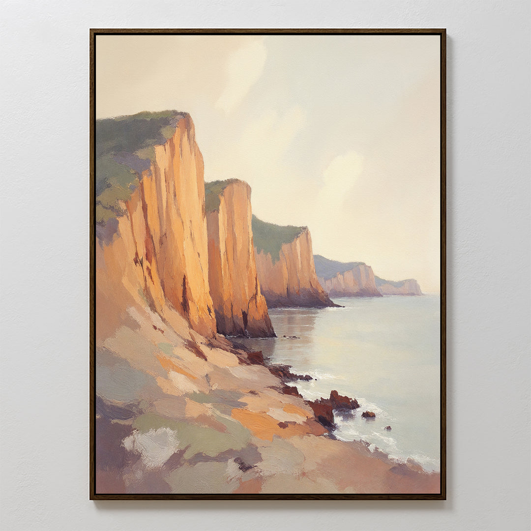 The Coastal Grandeur Canvas Art - Vertical features sunlit seaside cliffs above a calm ocean with rocky slopes and soft clouds in warm hues—an ideal piece of coastal wall art.