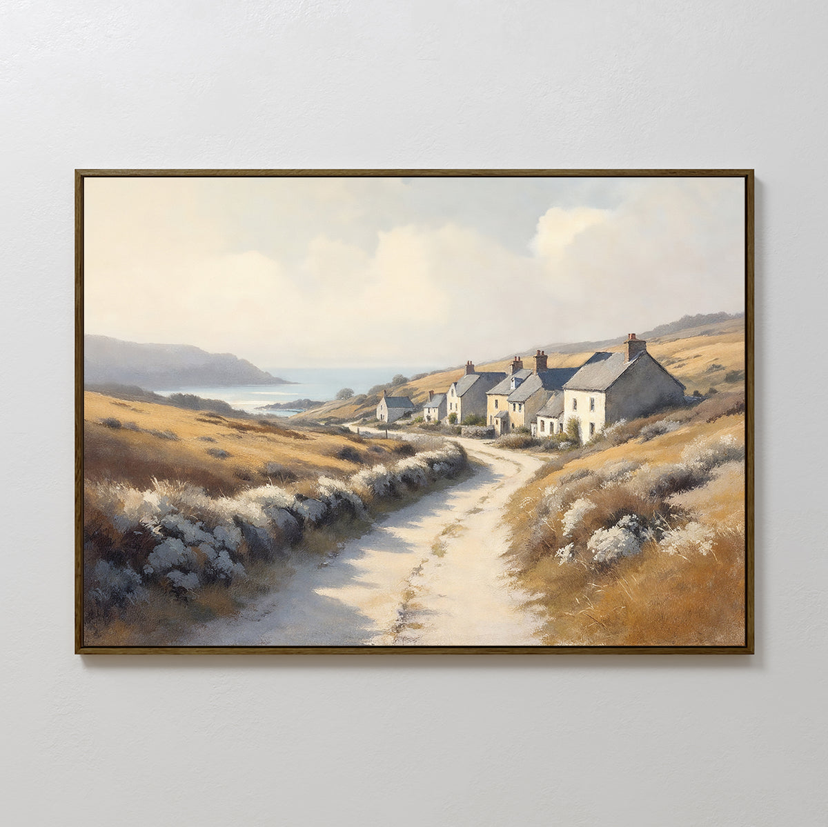 The Coastal Haven Canvas Art - Horizontal showcases a rustic landscape with white cottages, golden fields, distant hills, and a calm sea under a cloudy sky—an ideal coastal village print for tranquil spaces.