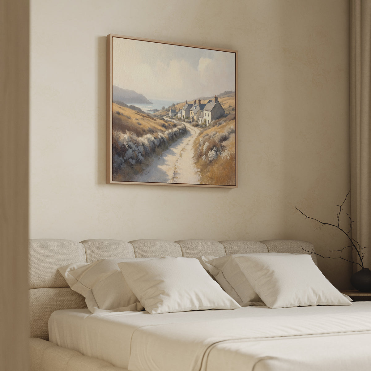A cozy bedroom features a beige bed with white pillows and the "Coastal Haven Canvas Art - Square" above the headboard, adding minimal, soft-toned décor with rustic charm.