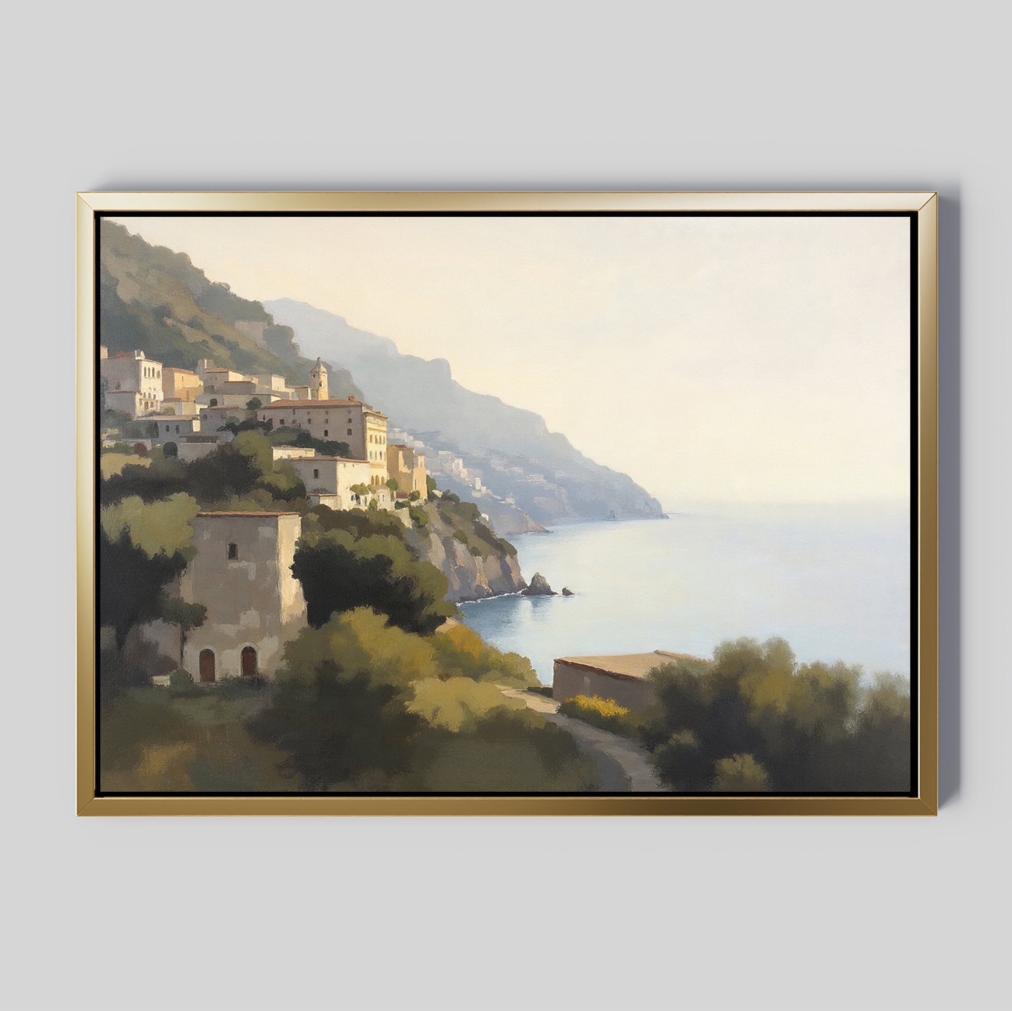 The "Italian Reverie Canvas Art - Horizontal" features a framed Mediterranean coastal village on a hillside, with sunlit buildings above the tranquil sea and lush greenery under a hazy golden sky.
