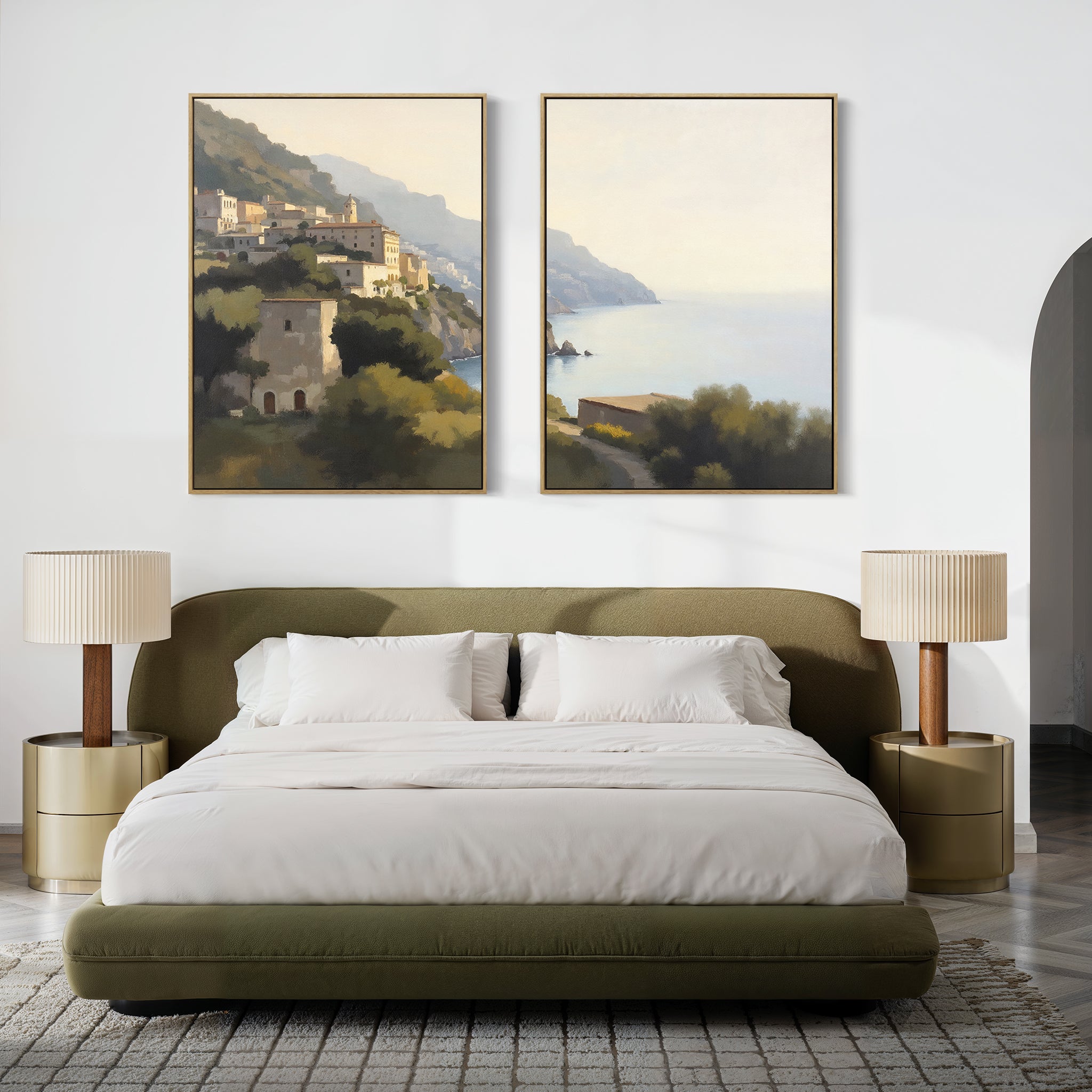 A modern bedroom features a low olive-green bed, white bedding, beige nightstands with matching lamps, and “Italian Reverie - Set of 2” large Mediterranean canvas prints above the headboard for an elegant coastal decor touch.