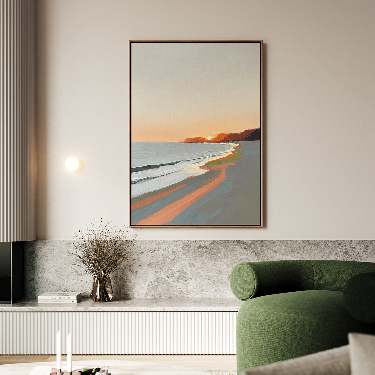 A modern living room features the Coastal Reverie Canvas Art - Vertical above a gray stone bench. A green chair, a vase with dried branches, and light candles complete this cozy, minimalist look—perfect for tranquil home decor.