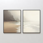 Coastal Silence - Set of 2 features framed canvas prints of a misty beach with gentle waves and distant cliffs in soft beige and gray tones, bringing serene Nordic Park-inspired calm to your space.