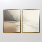 The "Coastal Silence - Set of 2" features framed canvas prints side by side, showcasing sandy beaches, misty cliffs, and gentle waves under a pale sky in neutral tones for a serene, minimalist coastal wall art display.
