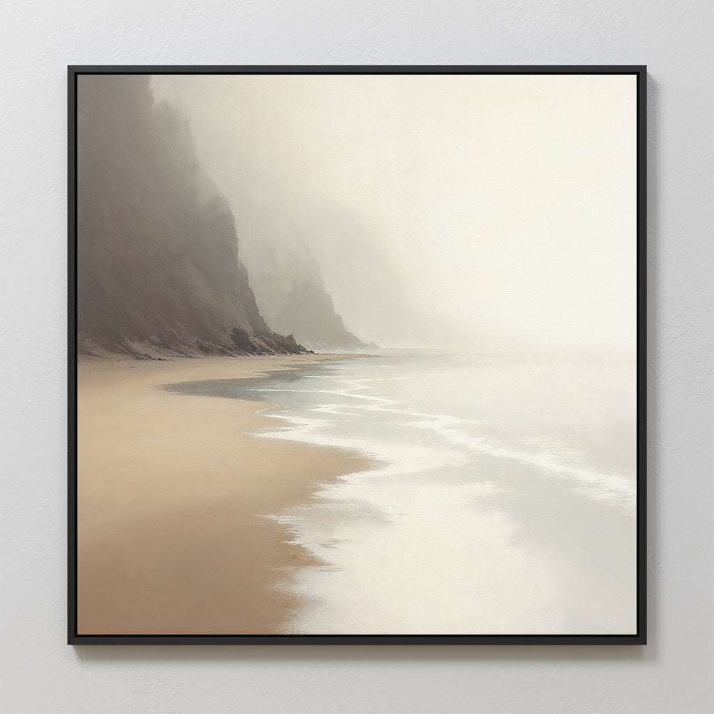 The Coastal Silence Canvas Art - Square features a serene beach with gentle waves, sandy shores, and misty cliffs fading into the background, all in a natural palette for a calm, minimalistic look.