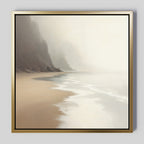 The Coastal Silence Canvas Art - Square features a misty shoreline with gentle waves, sandy beach, and cliffs fading into fog. Its soft, muted colors create a calm and serene coastal atmosphere.