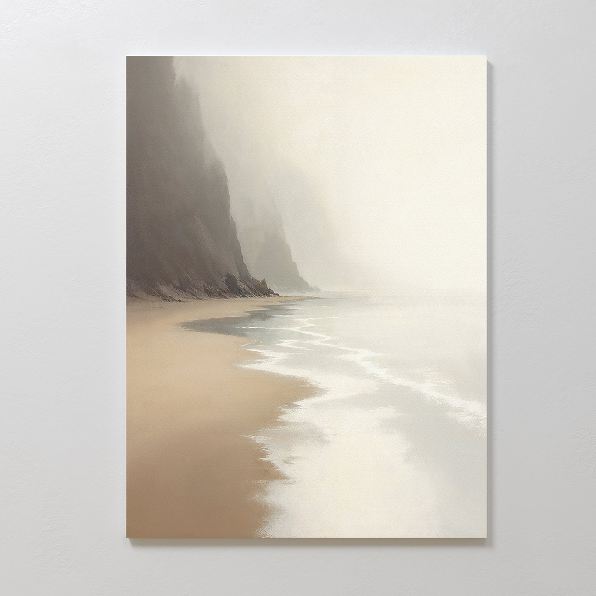 Coastal Silence Canvas Art - Vertical captures a misty coastal scene with gentle waves, sandy beach, and steep cliffs fading into a foggy gray sky. Its calm mood and muted earthy tones make it perfect for adding serenity to any space.