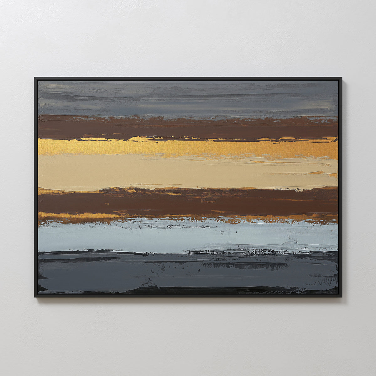 The Coastal Strata Canvas Art - Horizontal features earthy sophistication with horizontal stripes in brown, gold, beige, blue, and gray. Textured brushstrokes add depth to this contemporary print, elegantly framed in black on a white wall.
