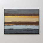 The Coastal Strata Canvas Art - Horizontal features earthy sophistication with horizontal stripes in brown, gold, beige, blue, and gray. Textured brushstrokes add depth to this contemporary print, elegantly framed in black on a white wall.