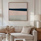 A modern living room with a beige sofa, neutral cushions, side table, lamp, dried flowers, and the My Store Coastal Blend Abstract Canvas Art—a large piece with blue, pink, and beige stripes—creates stylish decor.