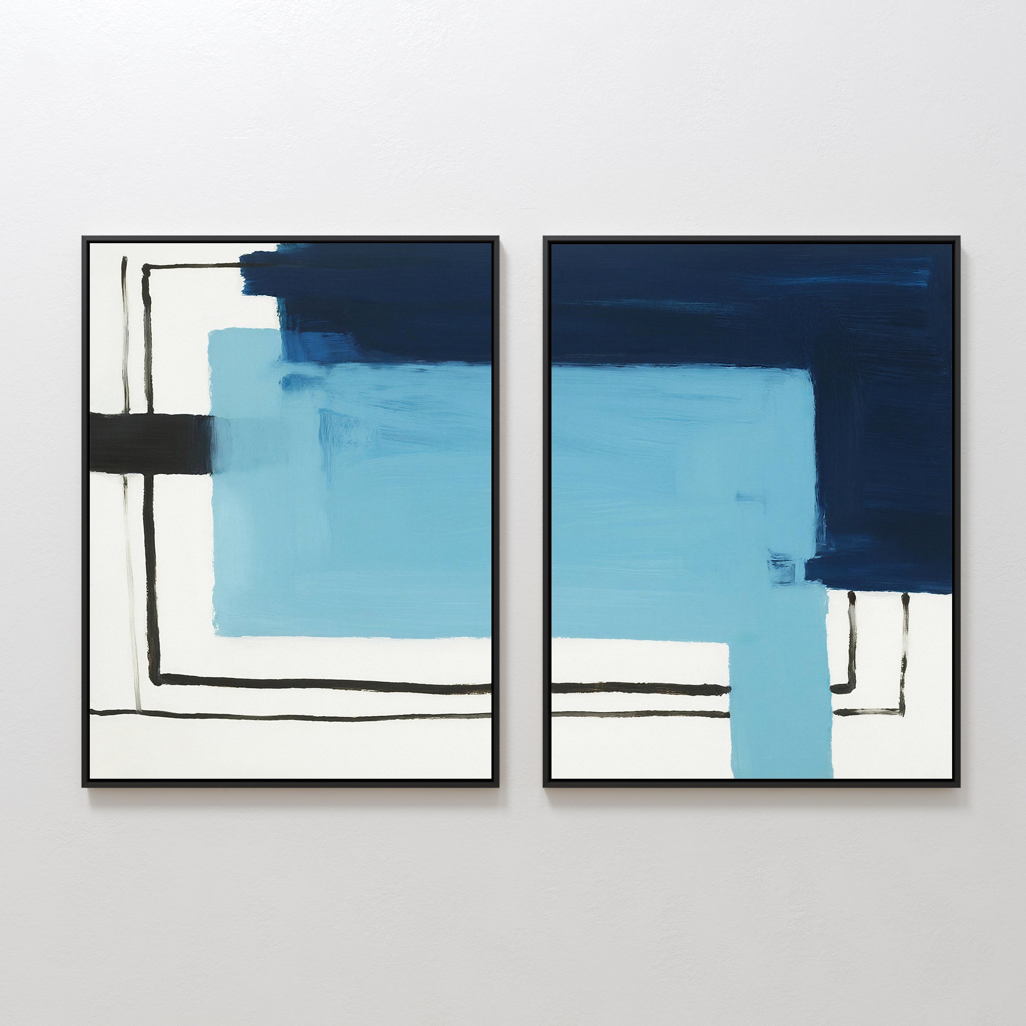 The Cobalt Intersection - Set Of 2 features abstract geometric wall art with bold blue, navy, and black blocks, white backgrounds, and intersecting black lines in sleek black frames—ideal for modern home decor.