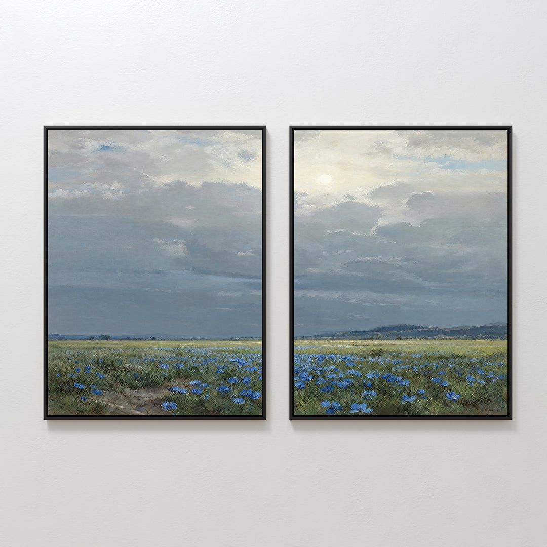 The “Cornflower Fields - Set of 2” includes two framed paintings featuring a continuous pastoral landscape of cornflower fields, distant hills, and a cloudy sky, creating a serene scene when displayed side by side.