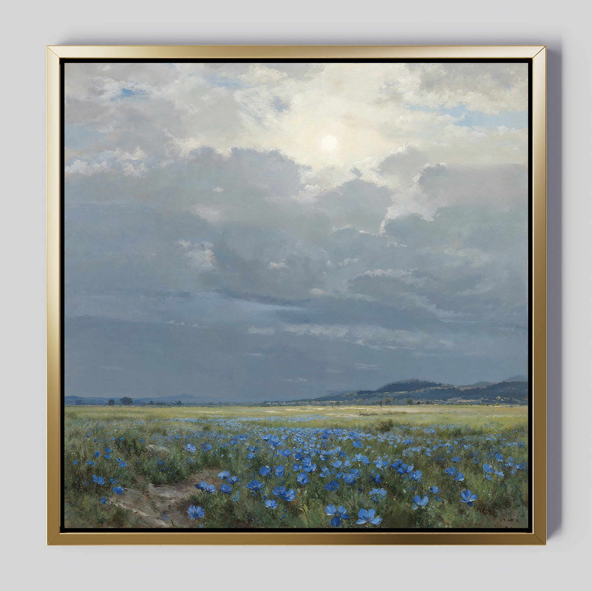 Bring tranquility to your space with the Cornflower Fields Canvas Art - Square, featuring a sunlit meadow of blue wildflowers beneath a cloudy sky and distant hills—a serene countryside landscape for your walls.