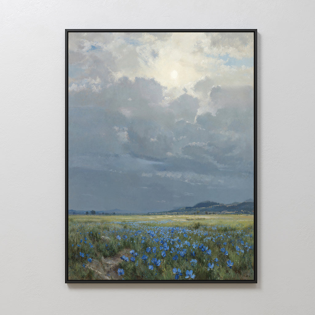 The Cornflower Fields Canvas Art - Vertical features a framed pastoral landscape of grassy cornflower fields beneath a cloudy sky, sunlight illuminating the scene with distant hills on the horizon.